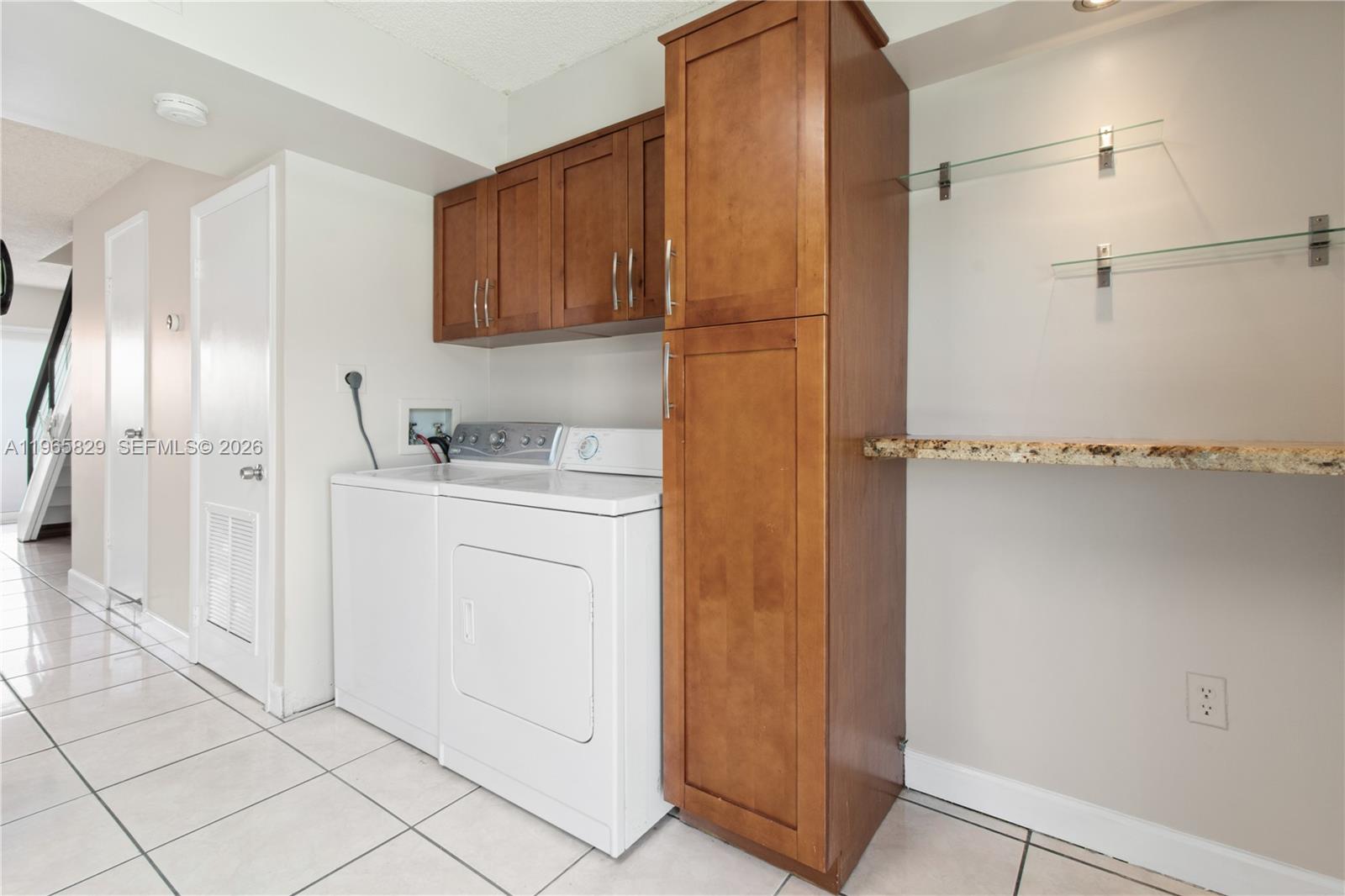 2162 West 60th Street, Unit 14203 Hialeah, FL 33016 - Photo 8 of 23 a room with storage and utility