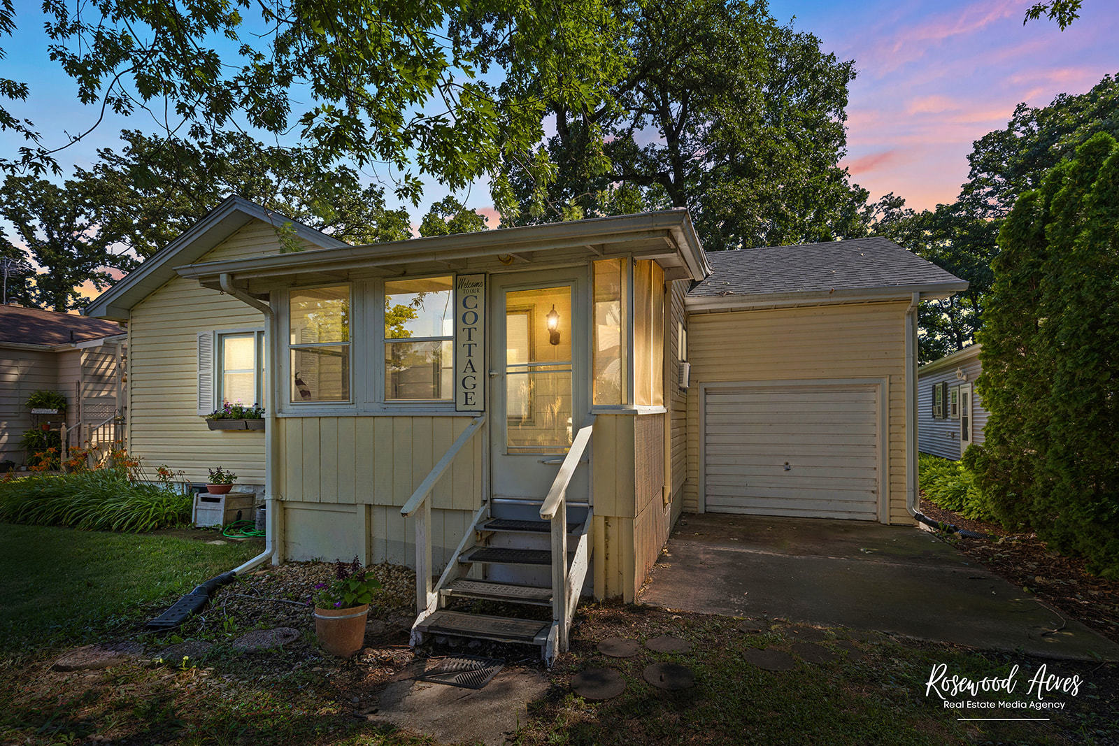 a front view of a house with a garden