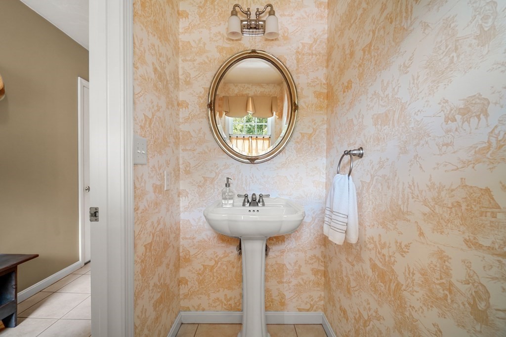 10 Sullivan Way Canton, MA 02021 - Photo 19 of 42 a bathroom with a sink and a mirror