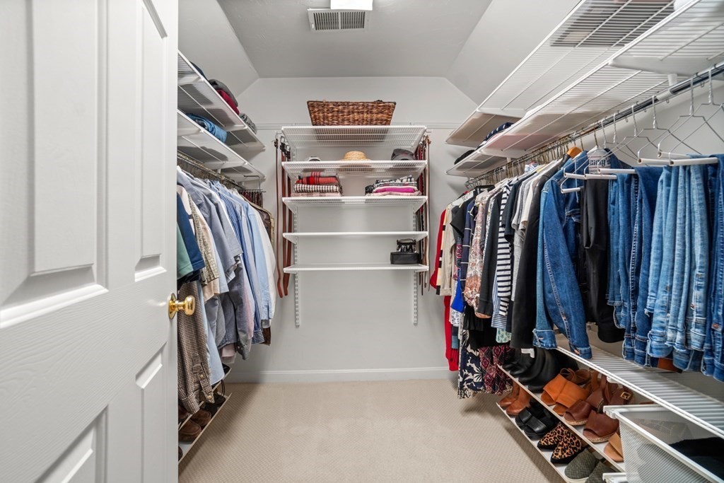 10 Sullivan Way Canton, MA 02021 - Photo 26 of 42 a view of walk in closet with clothes