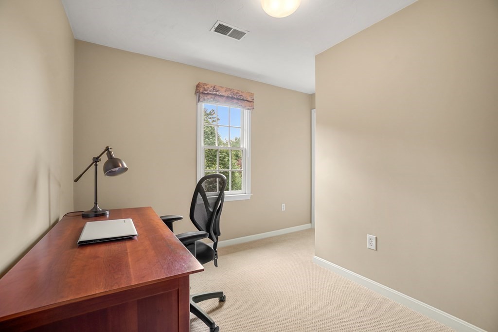 10 Sullivan Way Canton, MA 02021 - Photo 28 of 42 a view of a workspace with furniture and a window