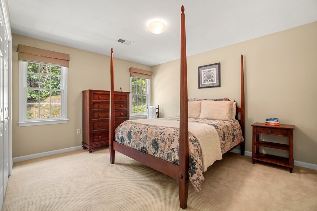 10 Sullivan Way Canton, MA 02021 - Photo 30 of 42 a bedroom with a bed and a window