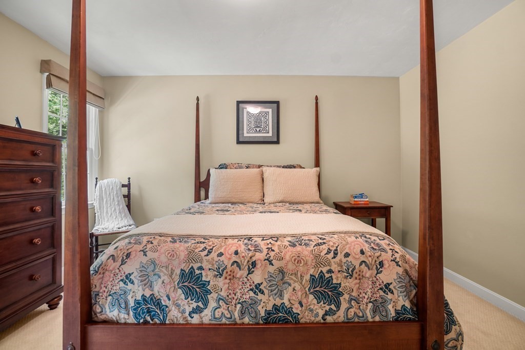 10 Sullivan Way Canton, MA 02021 - Photo 31 of 42 a bedroom with a bed and wooden floor