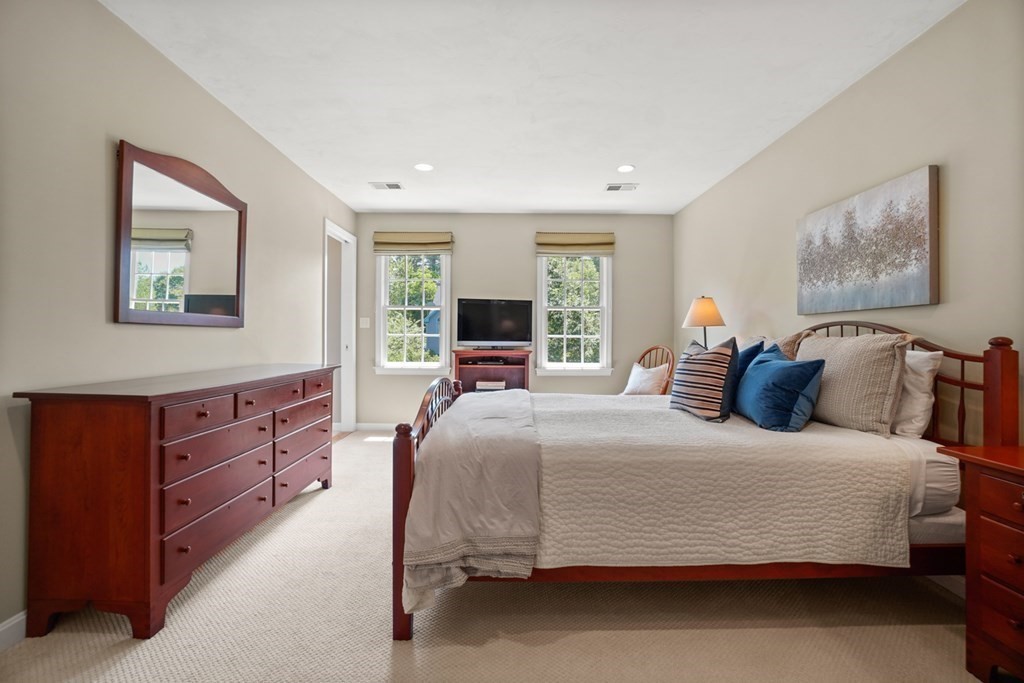 10 Sullivan Way Canton, MA 02021 - Photo 34 of 42 a bedroom with a bed and a couch