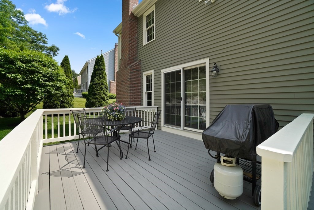 10 Sullivan Way Canton, MA 02021 - Photo 40 of 42 a view of balcony with furniture and wooden floor