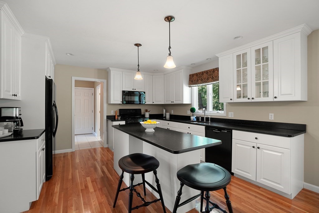 10 Sullivan Way Canton, MA 02021 - Photo 10 of 42 a kitchen with stainless steel appliances a sink a stove a refrigerator and cabinets