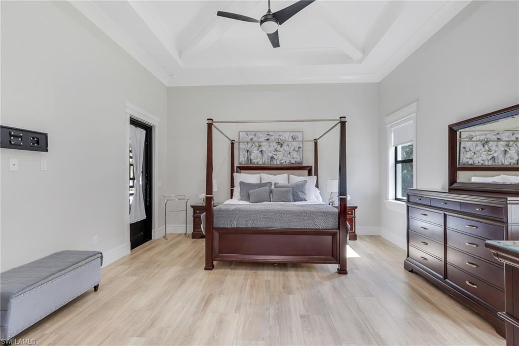530 1st Street Northwest Naples, FL 34120 - Photo 14 of 35 a living room with furniture and a flat screen tv