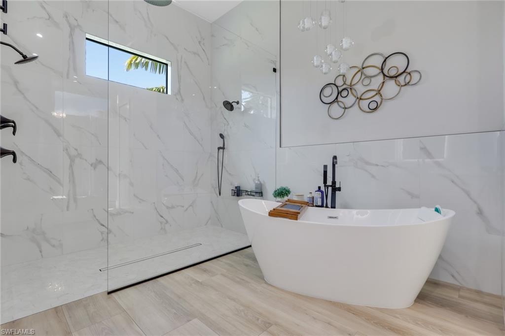 530 1st Street Northwest Naples, FL 34120 - Photo 17 of 35 a view of a bathtub in a bathroom