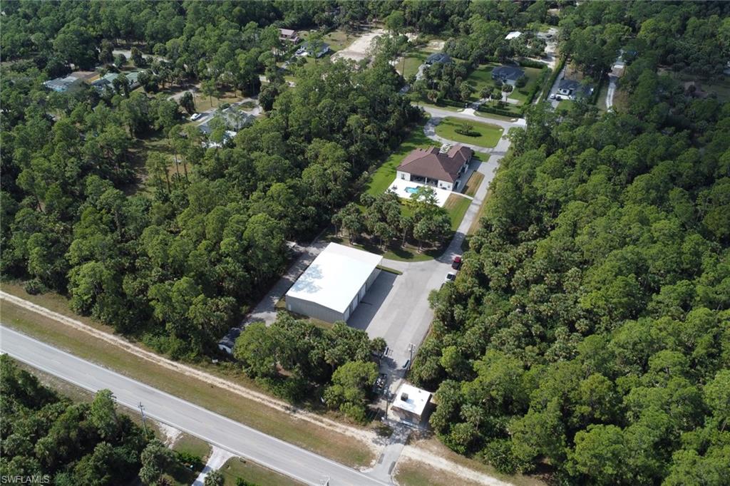 530 1st Street Northwest Naples, FL 34120 - Photo 2 of 35 an aerial view of a house with a yard and street view