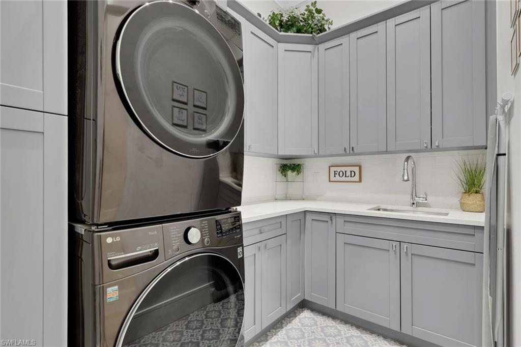 530 1st Street Northwest Naples, FL 34120 - Photo 22 of 35 a utility room with dryer and washer