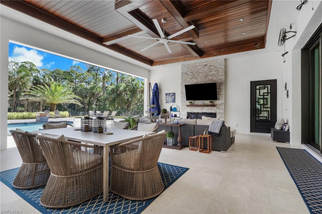 530 1st Street Northwest Naples, FL 34120 - Photo 26 of 35 a view of a dining room with furniture window and outside view
