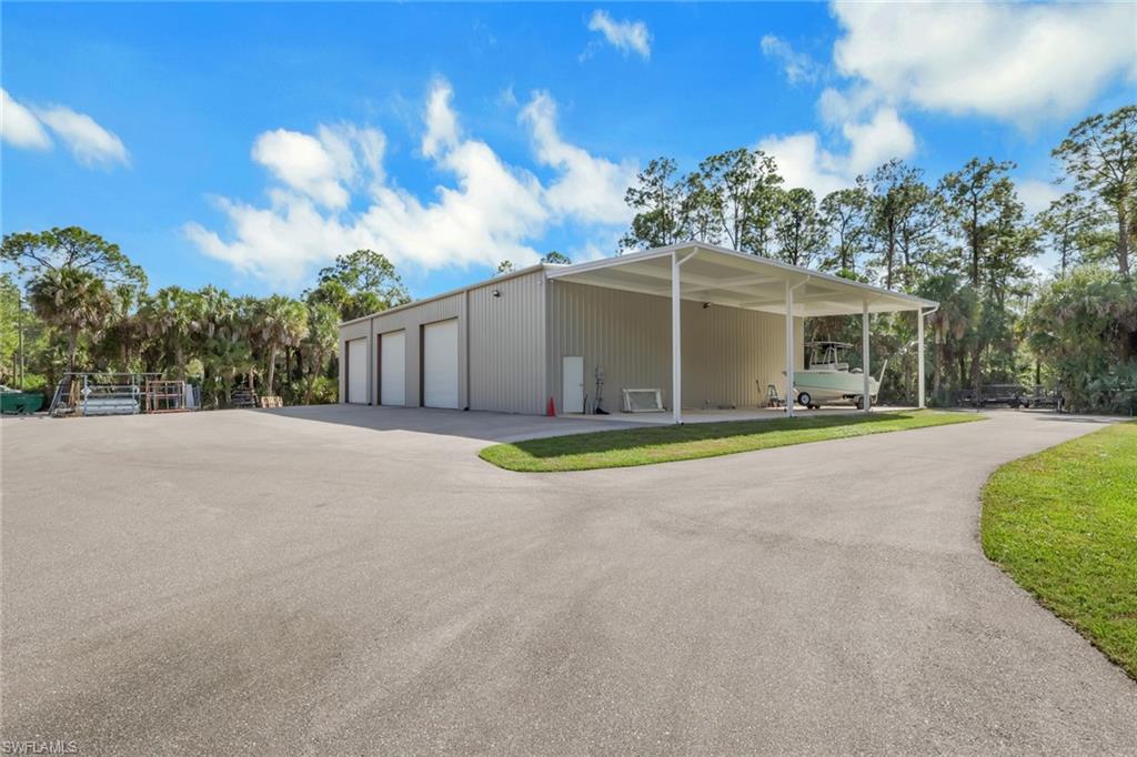 530 1st Street Northwest Naples, FL 34120 - Photo 31 of 35 a view of outdoor space yard and swimming pool