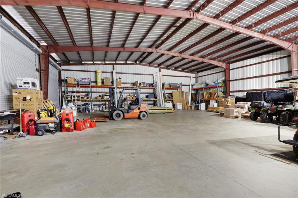 530 1st Street Northwest Naples, FL 34120 - Photo 32 of 35 a view of parking garage with cars