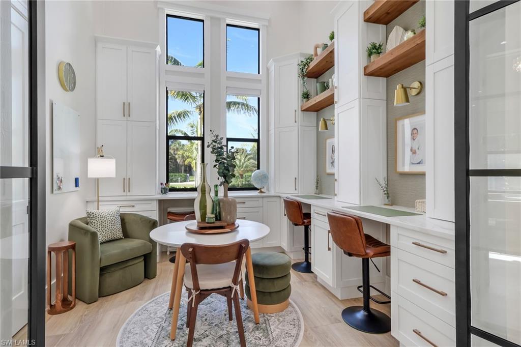 530 1st Street Northwest Naples, FL 34120 - Photo 8 of 35 a living room with furniture and a potted plant
