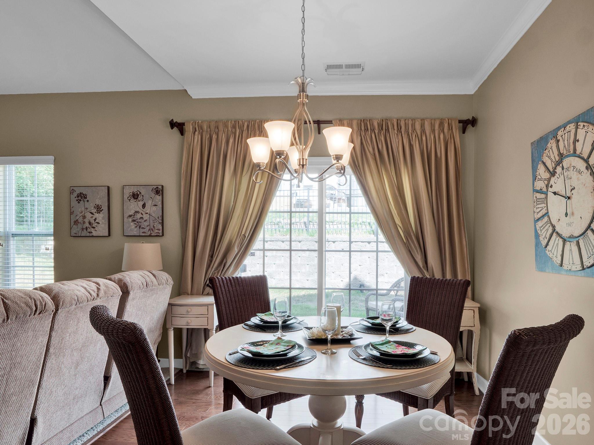 14726 Intermilan Way Charlotte, NC 28277 - Photo 15 of 38 a dining room with furniture a chandelier and window