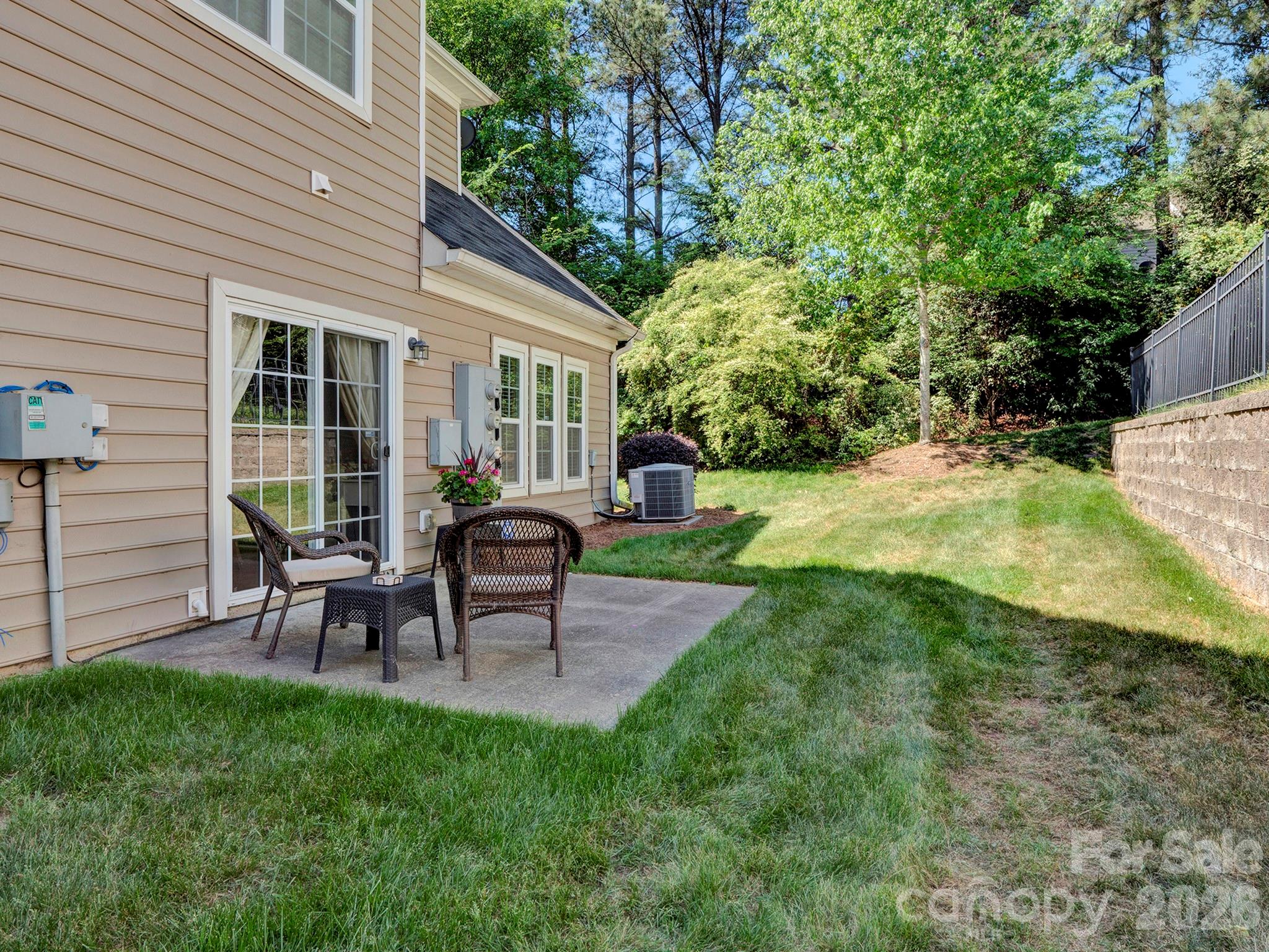 14726 Intermilan Way Charlotte, NC 28277 - Photo 17 of 38 a view of a house with backyard sitting area and garden