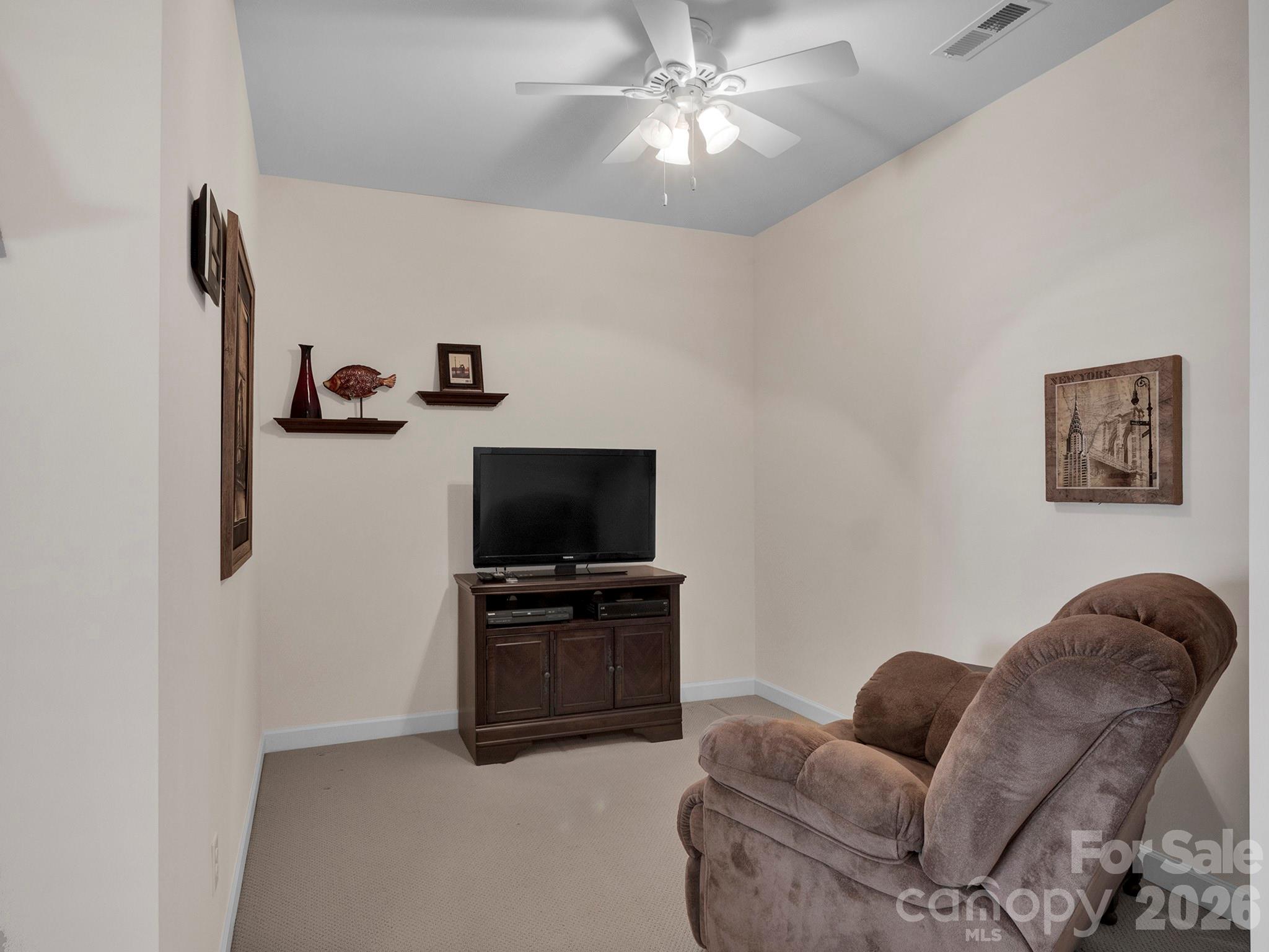 14726 Intermilan Way Charlotte, NC 28277 - Photo 28 of 38 a living room with furniture and a flat screen tv