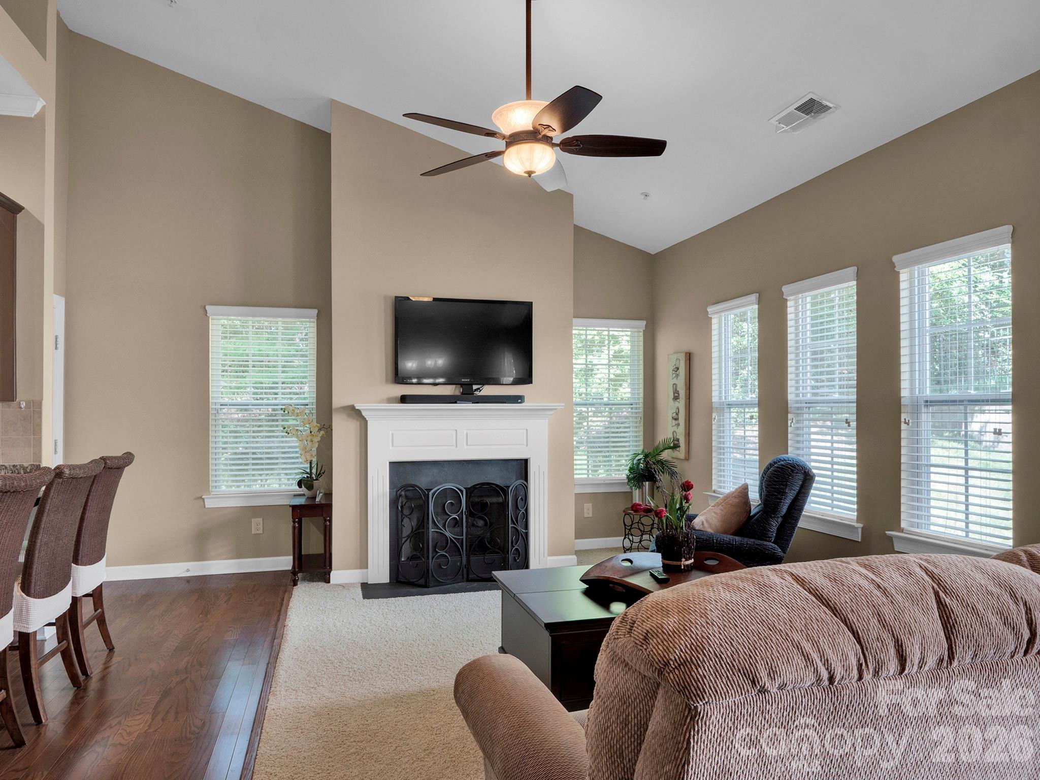 14726 Intermilan Way Charlotte, NC 28277 - Photo 3 of 38 a spacious bedroom with a bed and a fireplace