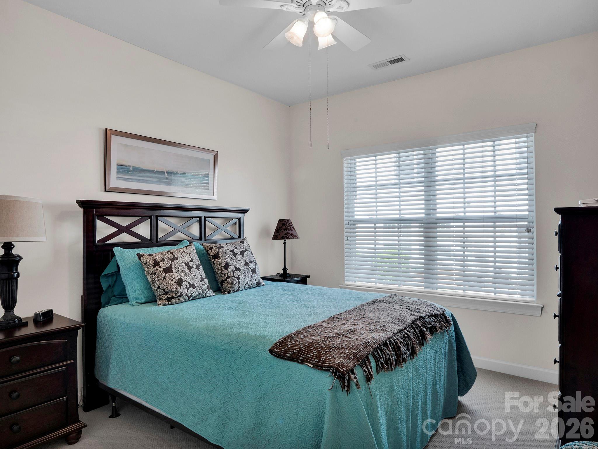 14726 Intermilan Way Charlotte, NC 28277 - Photo 31 of 38 a bedroom with a bed and a window