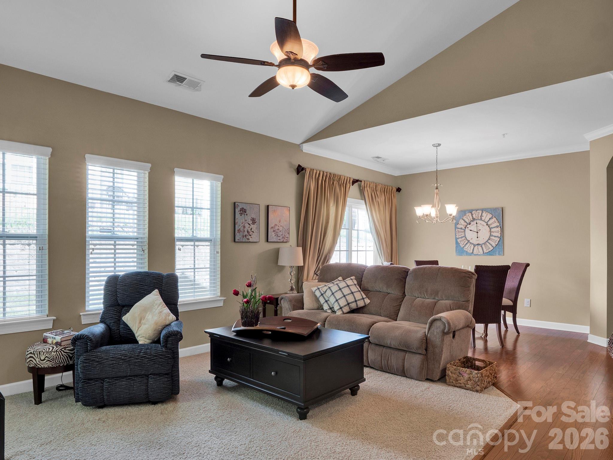 14726 Intermilan Way Charlotte, NC 28277 - Photo 4 of 38 a living room with furniture ceiling fan and a window