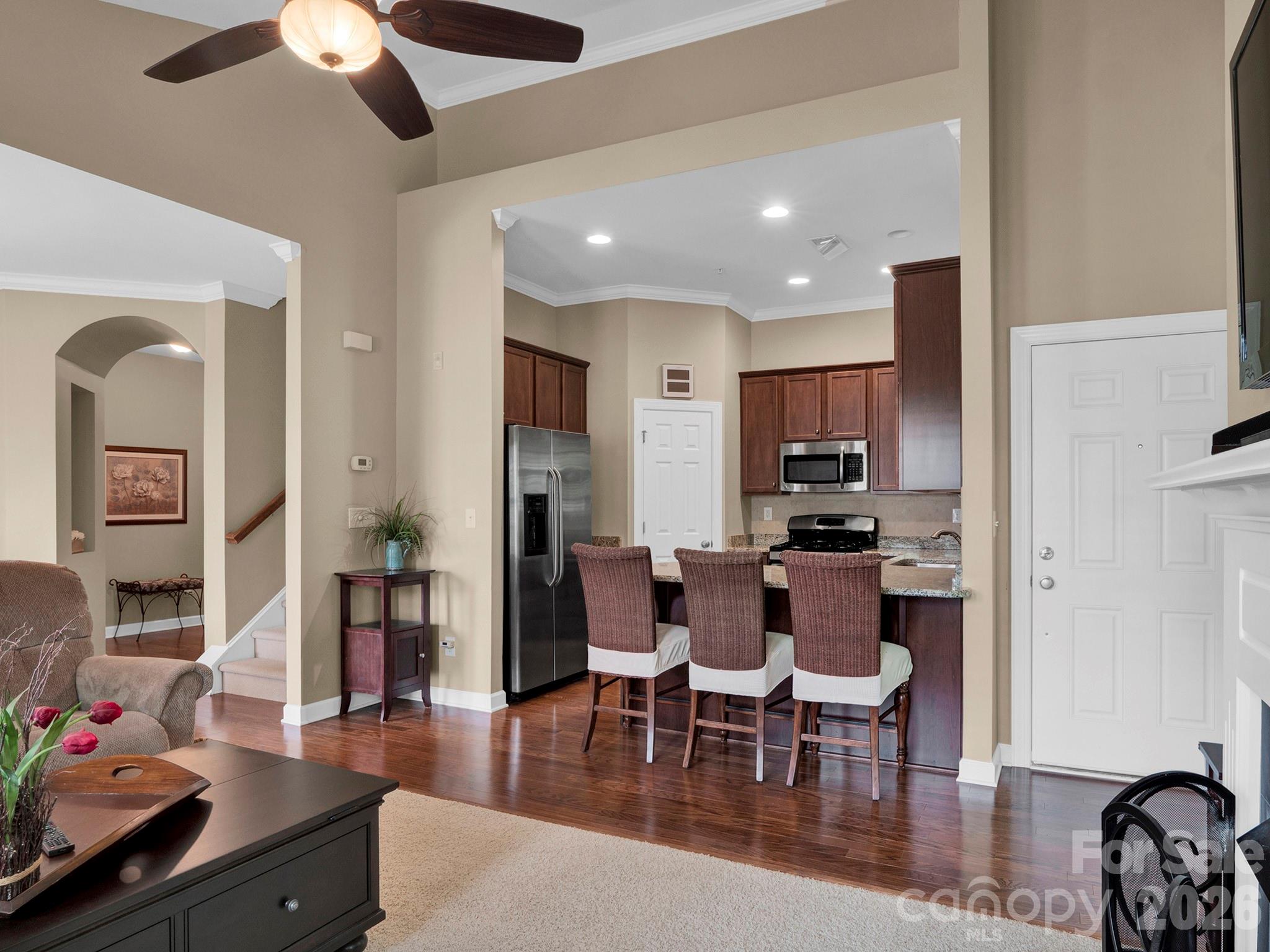 14726 Intermilan Way Charlotte, NC 28277 - Photo 6 of 38 a view of a dining room with furniture and wooden floor
