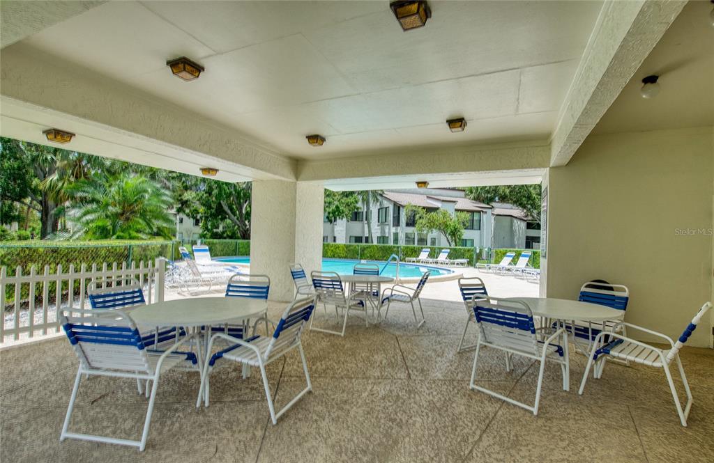 700 Starkey Road, Unit 1145 Largo, FL 33771 - Photo 44 of 63 a view of a dining room with furniture window and outside view