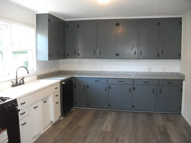 a view of cabinets with a sink
