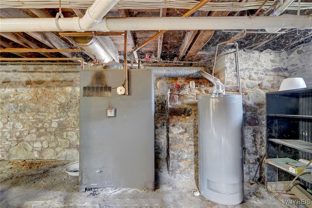 72 North Center Street Perry, NY 14530 - Photo 39 of 46 Gas Furnace / New Hotwater tank, Part Dirt Basement floor
