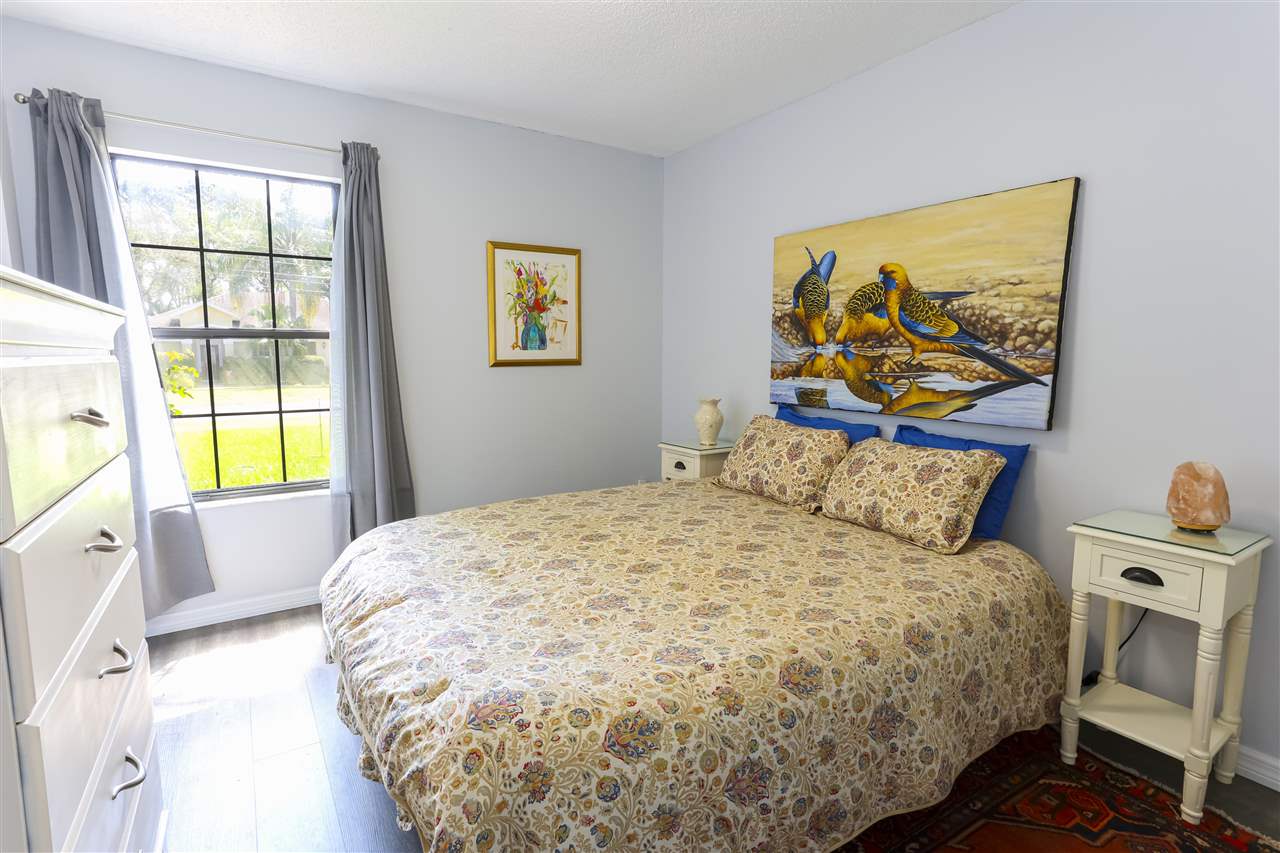 162 Segovia Road St. Augustine, FL 32086 - Photo 14 of 29 a bedroom with a bed and a window