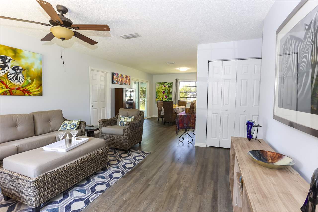 162 Segovia Road St. Augustine, FL 32086 - Photo 3 of 29 a living room with furniture and a wooden floor