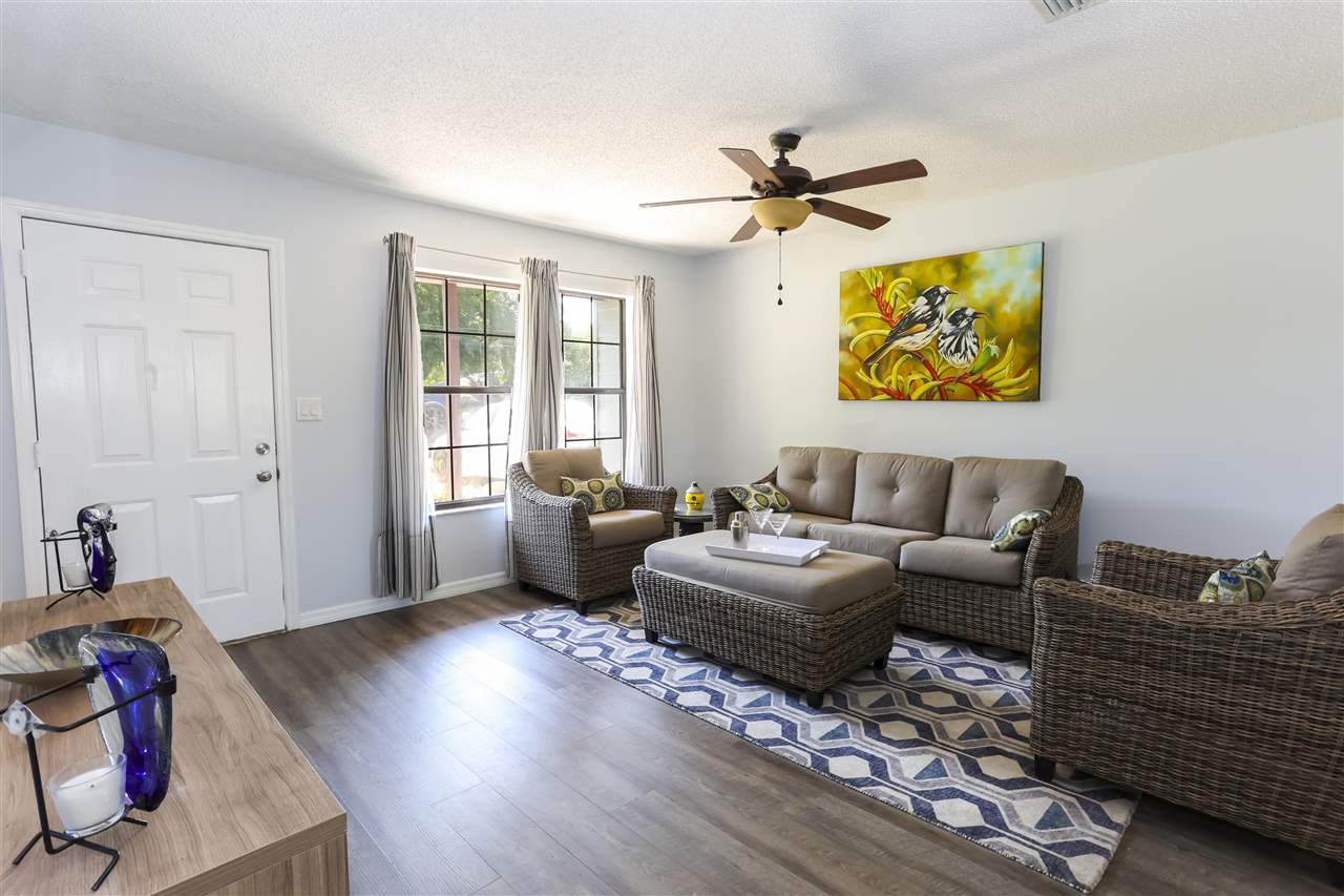 162 Segovia Road St. Augustine, FL 32086 - Photo 5 of 29 a living room with fireplace furniture and a wooden floor
