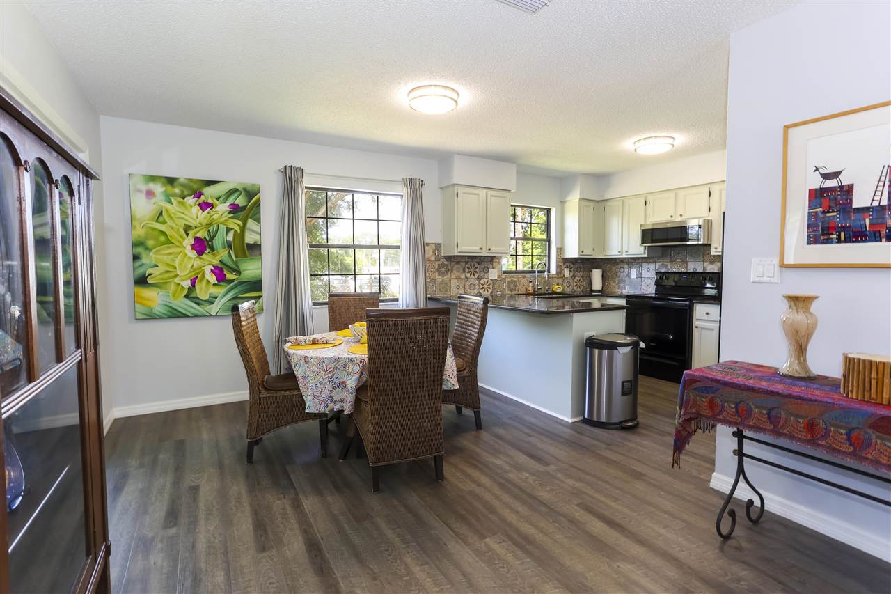 162 Segovia Road St. Augustine, FL 32086 - Photo 7 of 29 a view of a dining room with furniture window and wooden floor