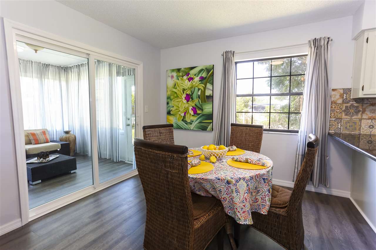 162 Segovia Road St. Augustine, FL 32086 - Photo 8 of 29 a view of a dining room with furniture window and wooden floor