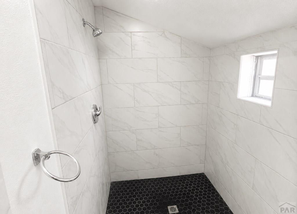 207 Spring Street Pueblo, CO 81003 - Photo 11 of 11 a bathroom with a white shower curtain