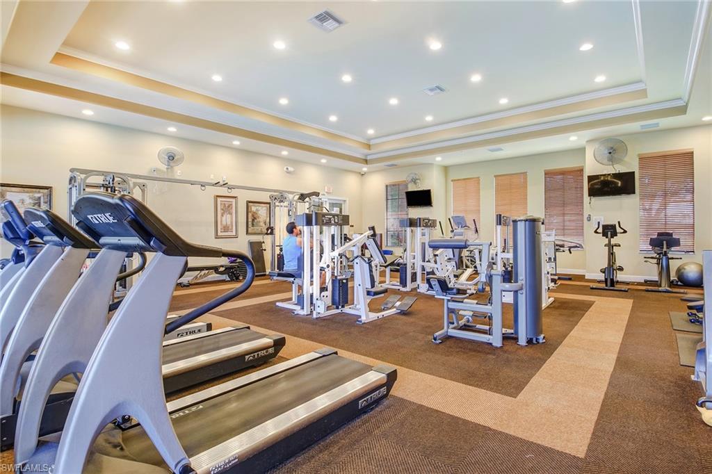 15243 Summit Pl Circle, Unit 247 Naples, FL 34119 - Photo 15 of 18 a view of a room with gym equipment