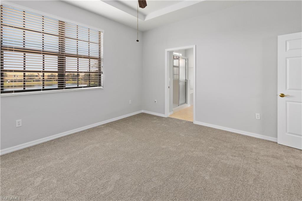 15243 Summit Pl Circle, Unit 247 Naples, FL 34119 - Photo 6 of 18 an empty room with windows
