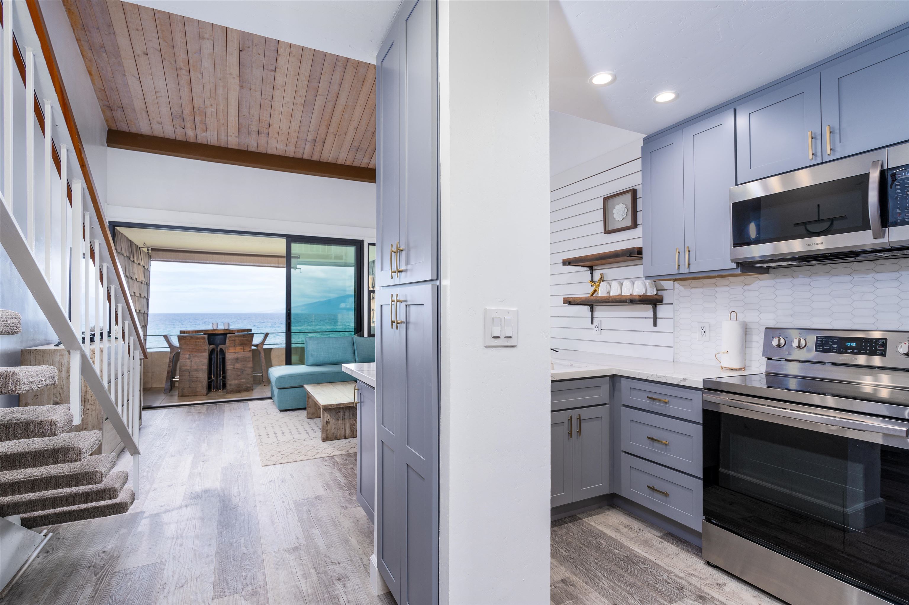 3741 Lower Honoapiilani Road, Unit 303 Lahaina, HI 96761 - Photo 11 of 30 a kitchen with a sink stainless steel appliances and cabinets