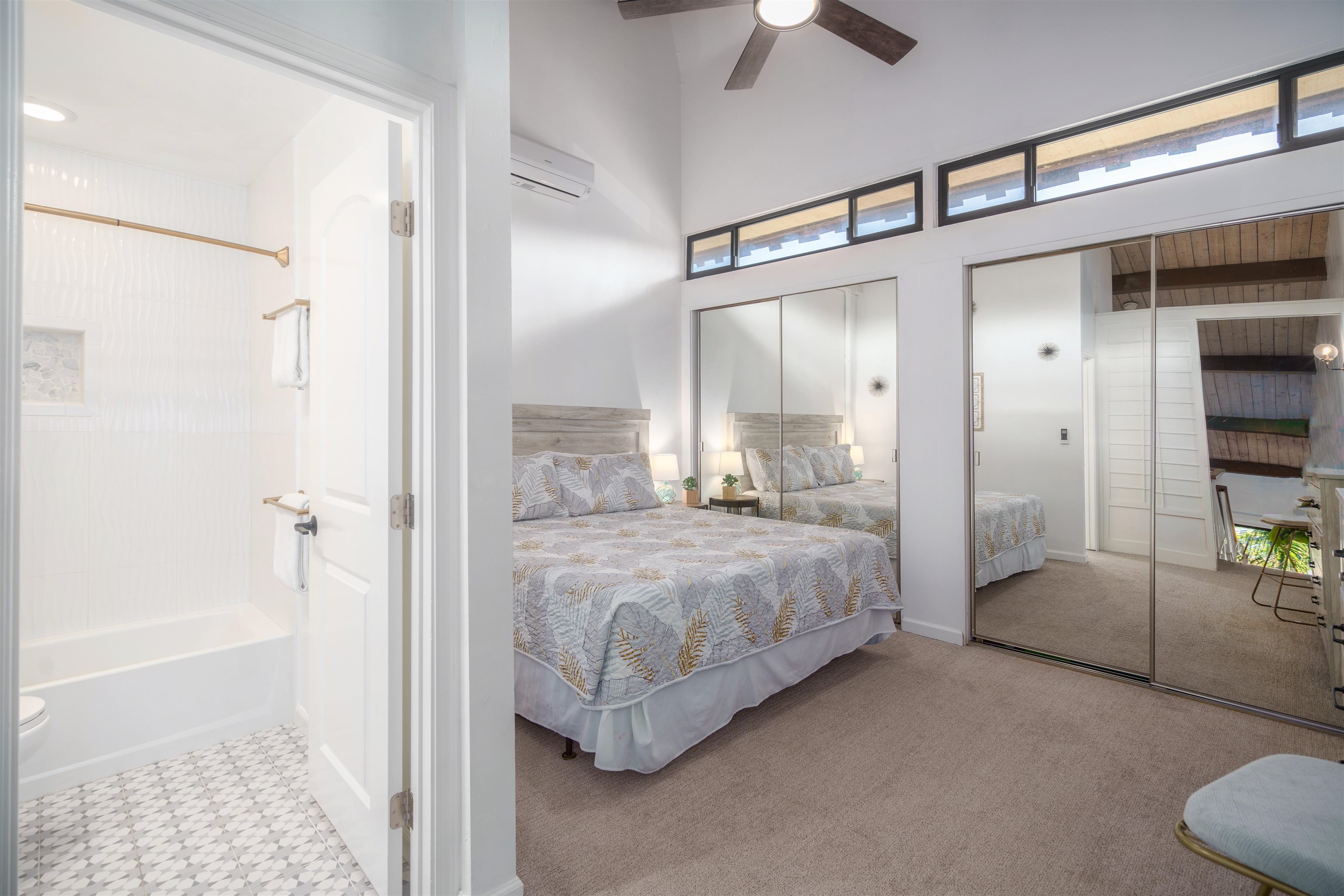 3741 Lower Honoapiilani Road, Unit 303 Lahaina, HI 96761 - Photo 14 of 30 a bedroom with a bed and a chandelier