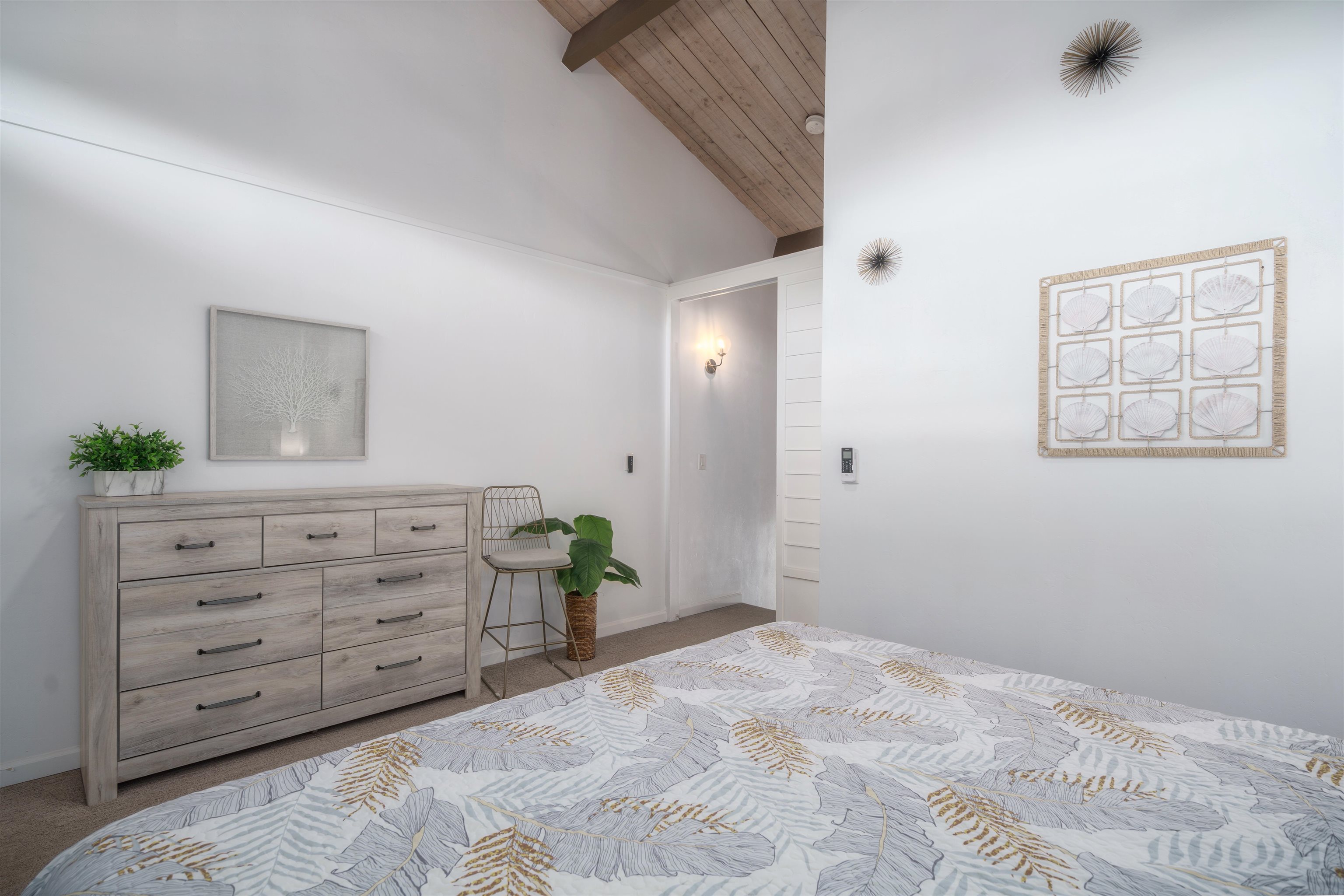 3741 Lower Honoapiilani Road, Unit 303 Lahaina, HI 96761 - Photo 16 of 30 a bedroom with a bed and a dresser