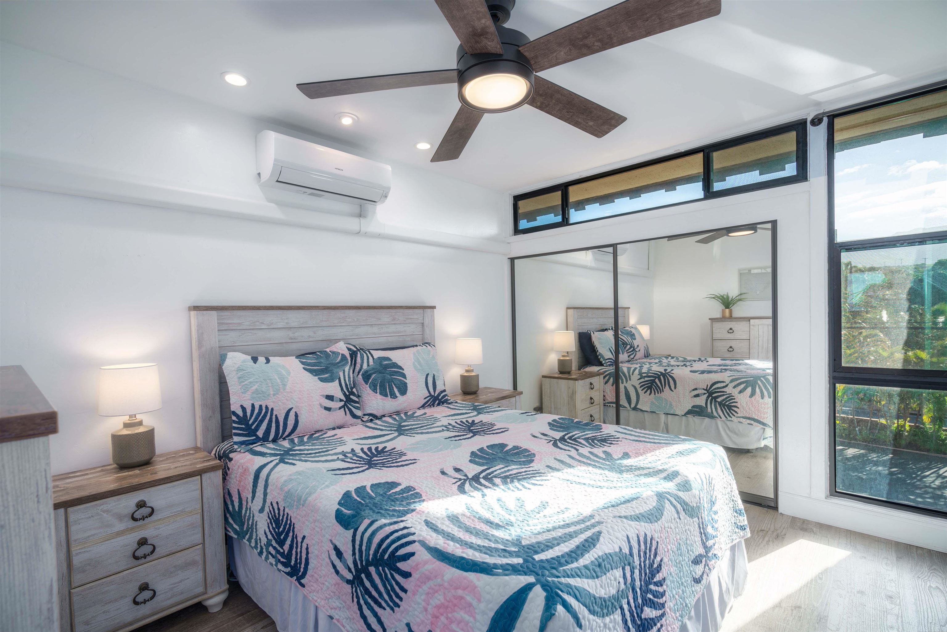 3741 Lower Honoapiilani Road, Unit 303 Lahaina, HI 96761 - Photo 19 of 30 a bedroom with a bed and a mirror