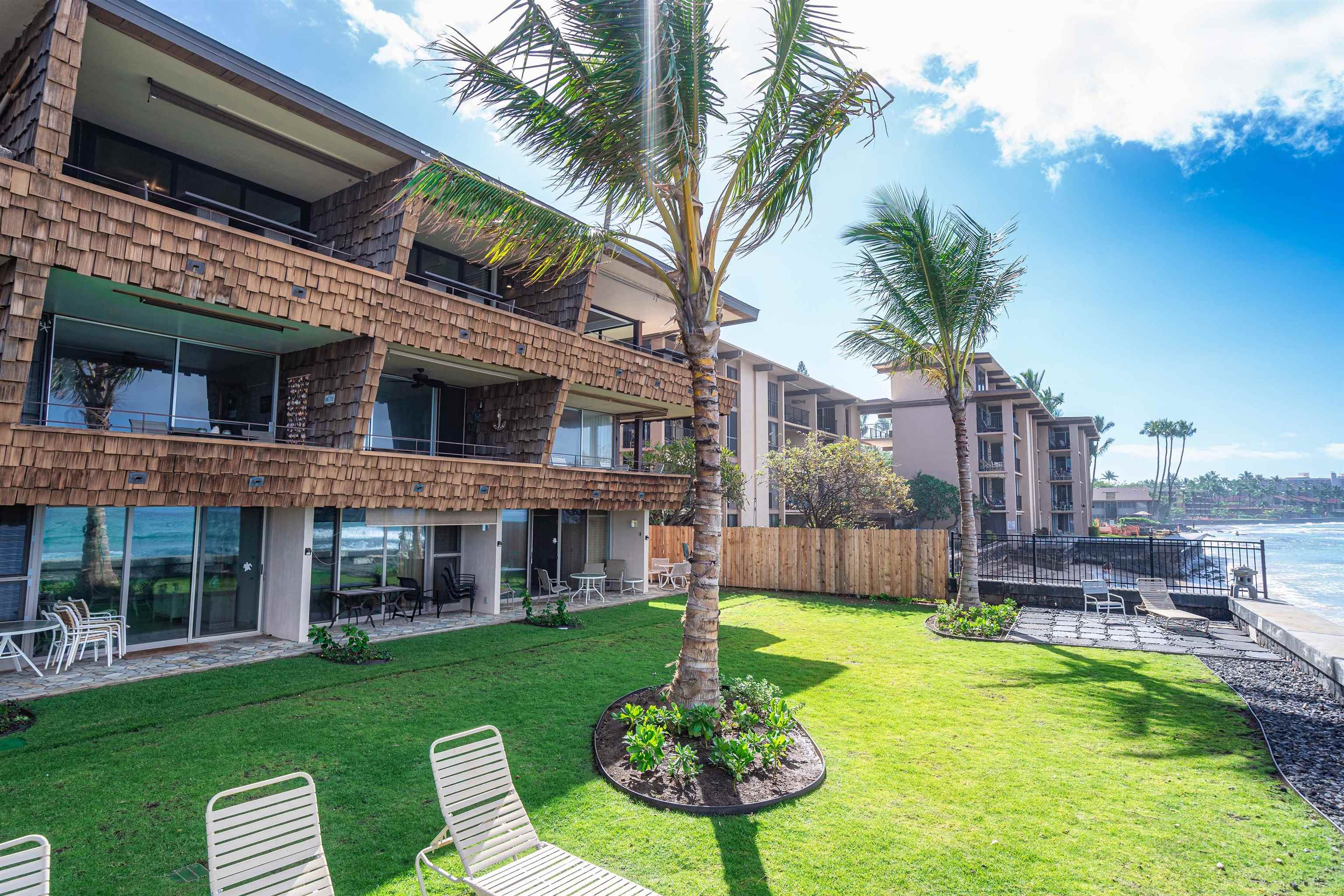 3741 Lower Honoapiilani Road, Unit 303 Lahaina, HI 96761 - Photo 30 of 30 a front view of a house with garden