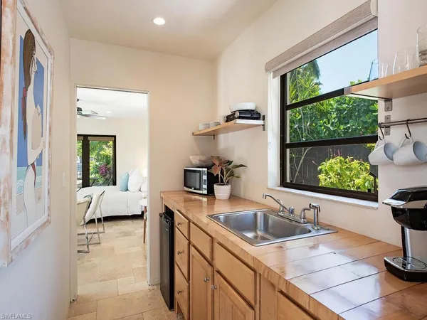 a kitchen with a sink and a window
