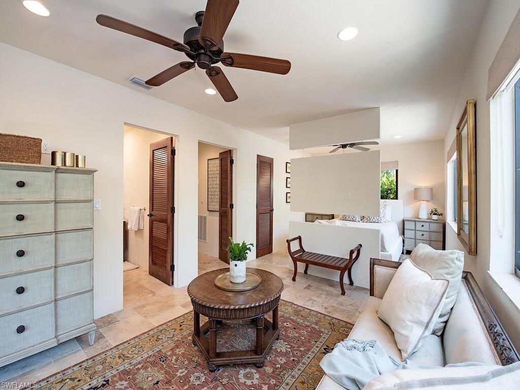 1200 9th Avenue North Naples, FL 34102 - Photo 18 of 22 a living room with furniture and a wooden floor