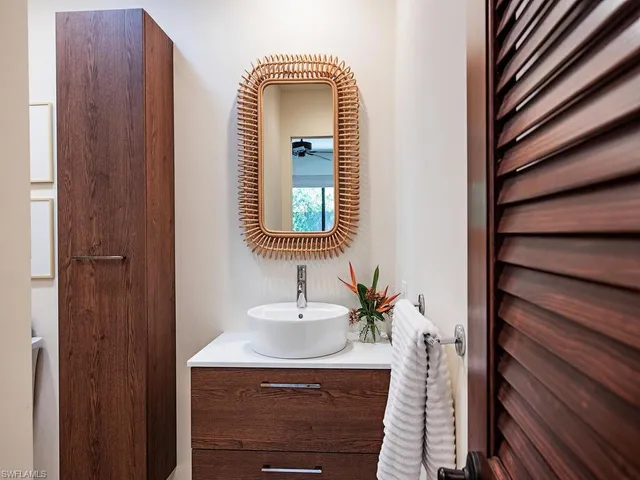 a bathroom with a sink and a mirror