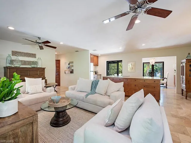 a living room with furniture or couch and a dining table
