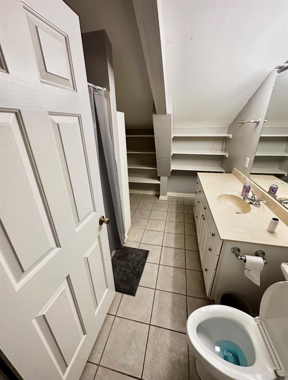 5205 Hudson Bend Road Austin, TX 78734 - Photo 19 of 21 a bathroom with a sink toilet and washing machine