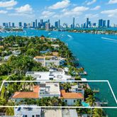 a view of a house with swimming pool and sitting area