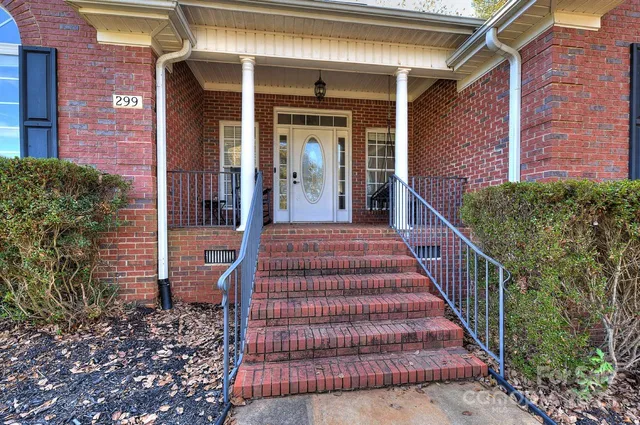 a view of a house with wooden floor and stairs