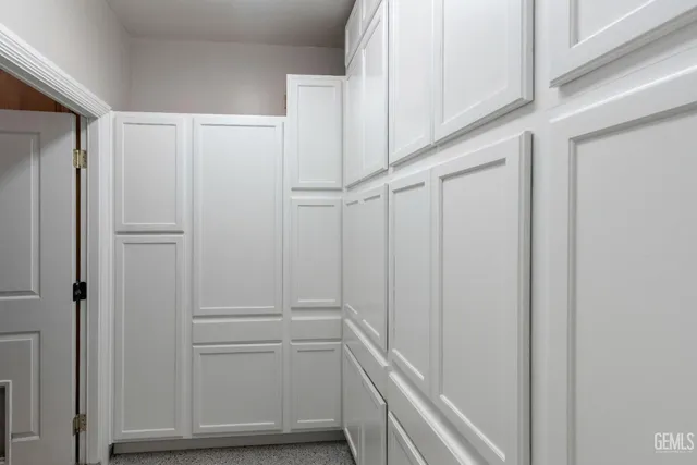 a view of swimming pool with outdoor seating and plants