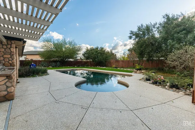 a living room with furniture and a ceiling fan